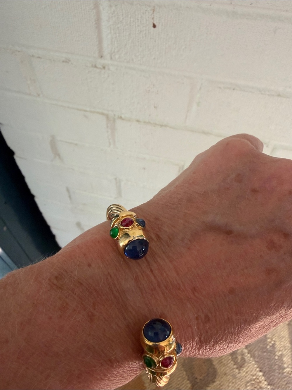 Gold cuff costume bracelet with cabuchon jewels